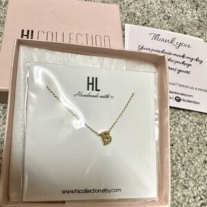 Tiny gold colored necklace with B initial. Brand new from HLCollection/Etsy